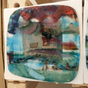 A fused glass drop before taking the ring off